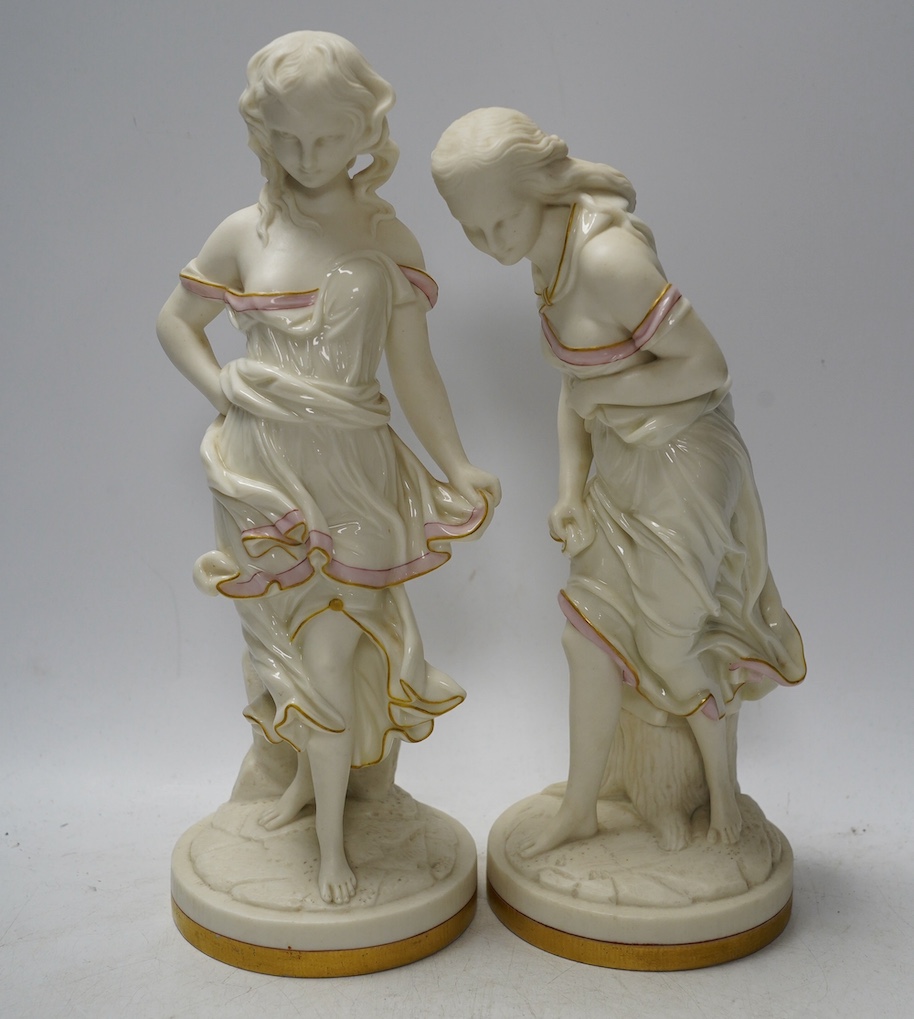 A pair of Worcester partially glazed figurines, 29cm high. Condition - good